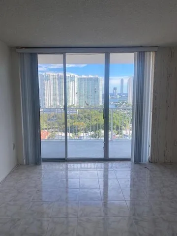 a view of an empty room and window