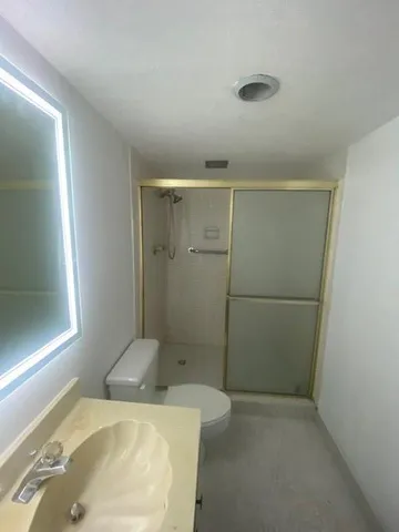a bathroom with a sink and shower