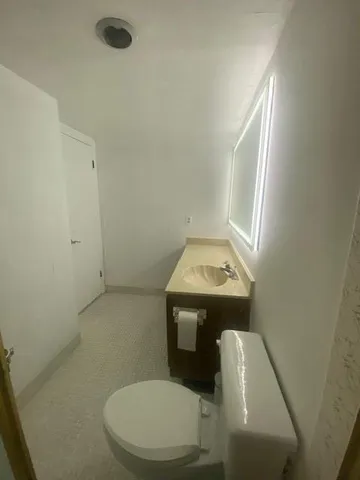 a bathroom with a toilet and a sink
