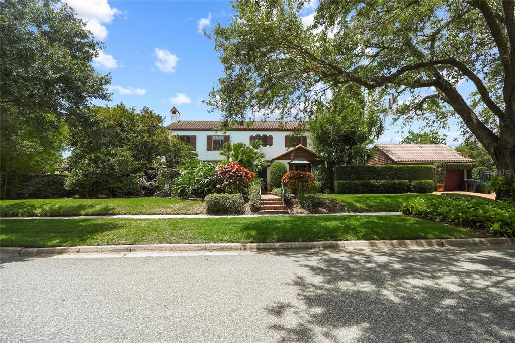 3202 Middlesex Road Orlando, FL 32803 - Photo 1 of 1 a front view of a house with a yard and a garage