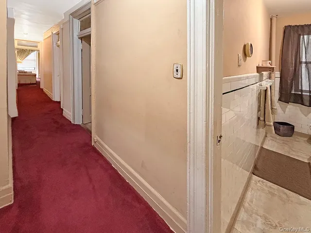 a view of a hallway with a wooden floor