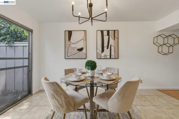 a dining room with furniture and window