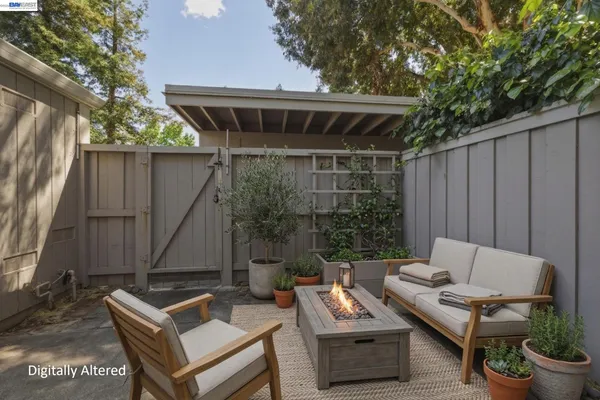 a backyard of a house with table and chairs