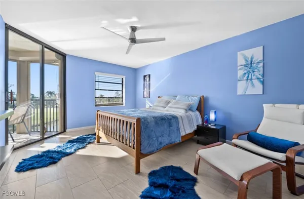 a bedroom with bed and a window