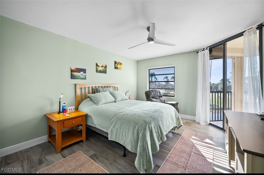 413 Augusta Boulevard, Unit 302 Naples, FL 34113 - Photo 14 of 22 a bedroom with a bed and a window