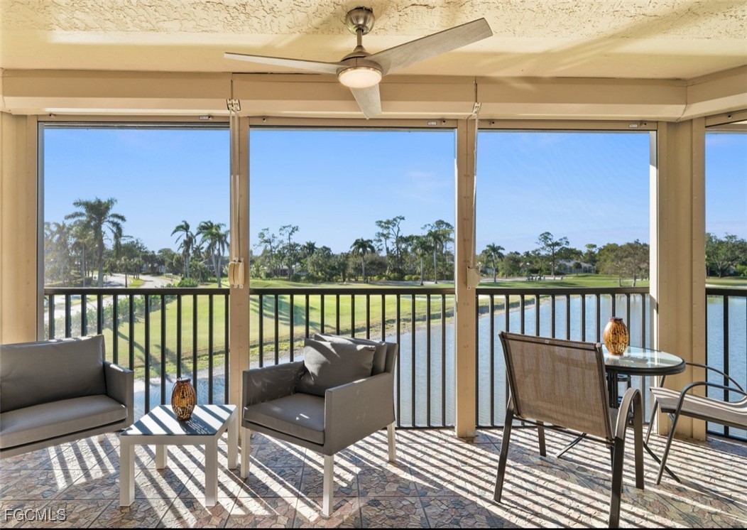 413 Augusta Boulevard, Unit 302 Naples, FL 34113 - Photo 16 of 22 a balcony view with a couple of chairs