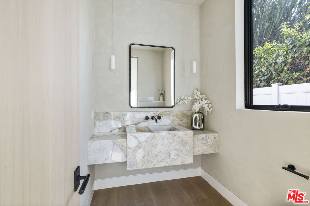 4220 Kenyon Avenue Los Angeles, CA 90066 - Photo 11 of 43 a bathroom with a sink and a mirror