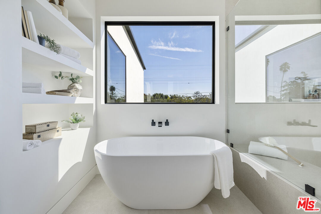 4220 Kenyon Avenue Los Angeles, CA 90066 - Photo 21 of 43 a bathroom with a bathtub and a sink