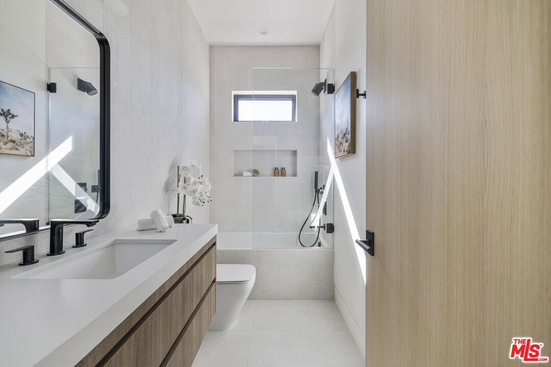 4220 Kenyon Avenue Los Angeles, CA 90066 - Photo 25 of 43 a bathroom with a sink a toilet and shower