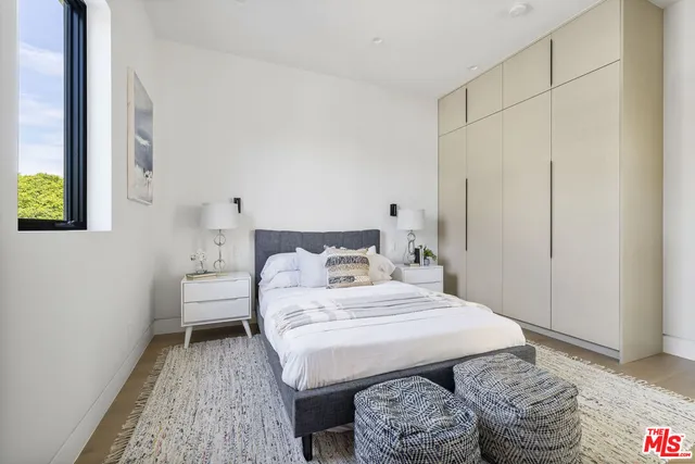 a bedroom with a bed and a view of bathroom