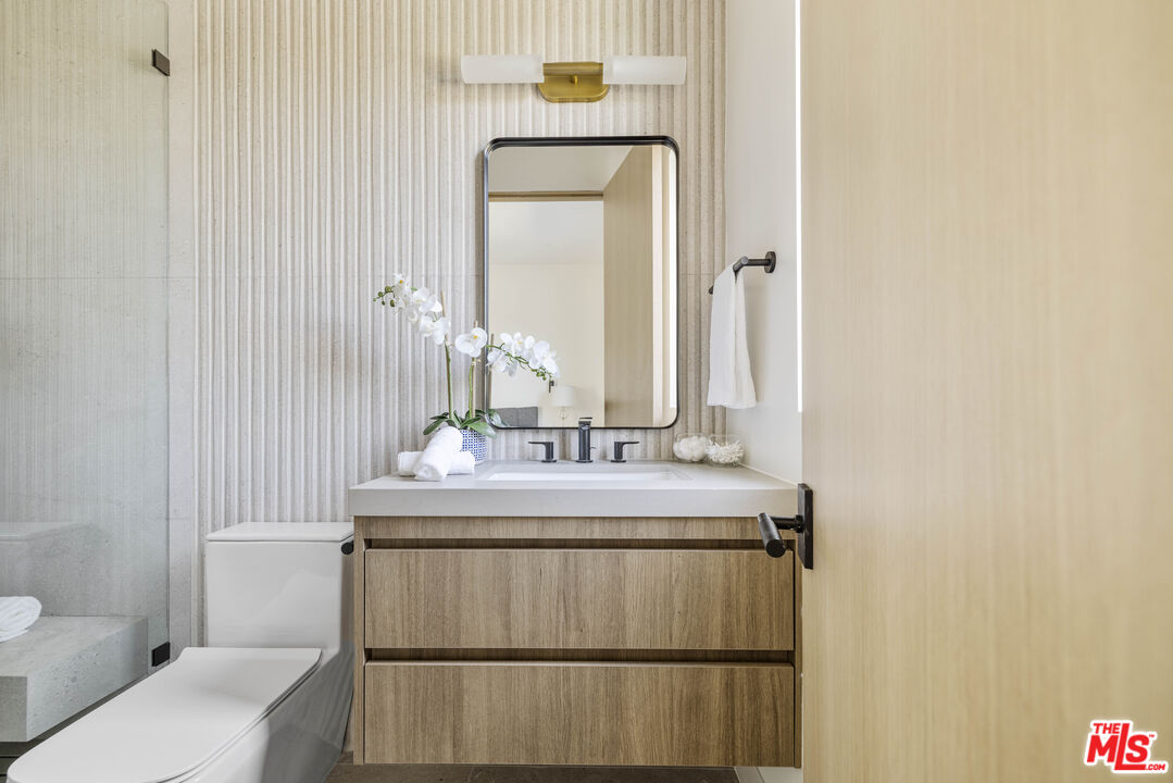 4220 Kenyon Avenue Los Angeles, CA 90066 - Photo 28 of 43 a bathroom with a sink a toilet and mirror