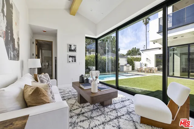 a kitchen with a sink cabinets and window