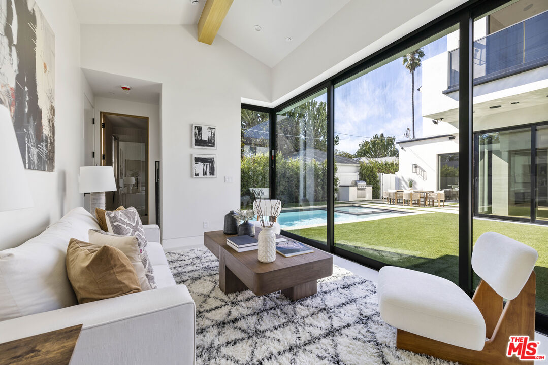 4220 Kenyon Avenue Los Angeles, CA 90066 - Photo 36 of 43 a living room with patio furniture and a garden