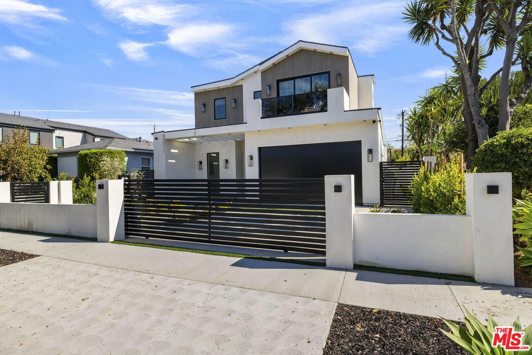 4220 Kenyon Avenue Los Angeles, CA 90066 - Photo 40 of 43 a front view of a house with a garage