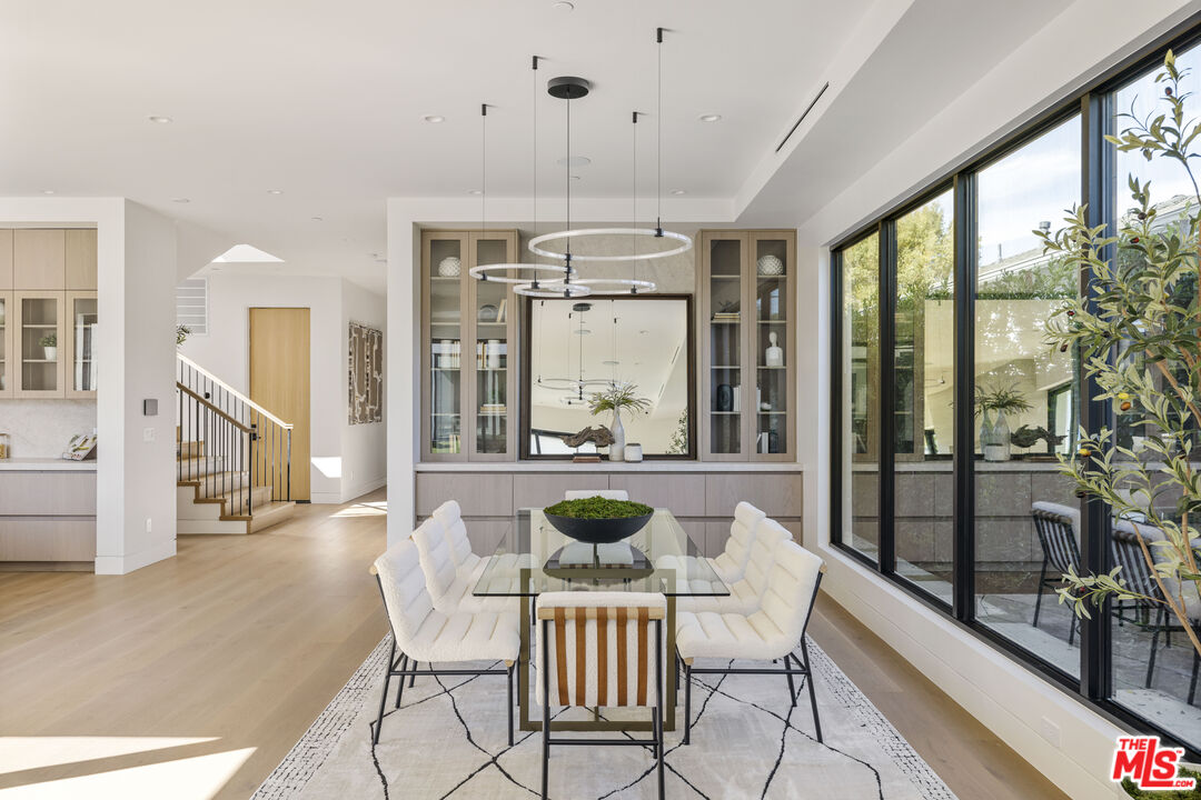 4220 Kenyon Avenue Los Angeles, CA 90066 - Photo 7 of 43 a dining room with furniture a chandelier and wooden floor