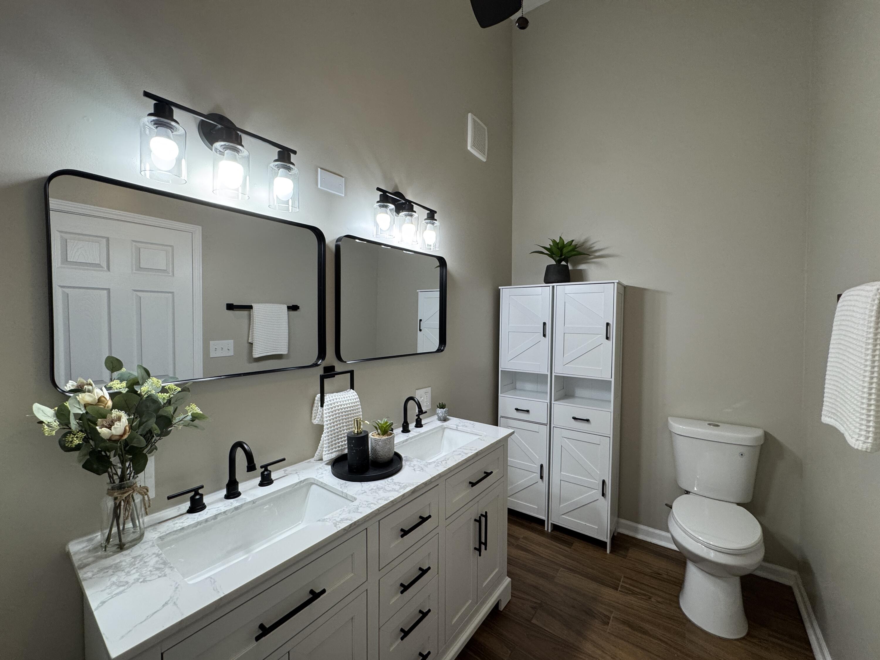 656 Montgomery Street Gary, IN 46403 - Photo 13 of 31 a bathroom with a toilet sink and mirror