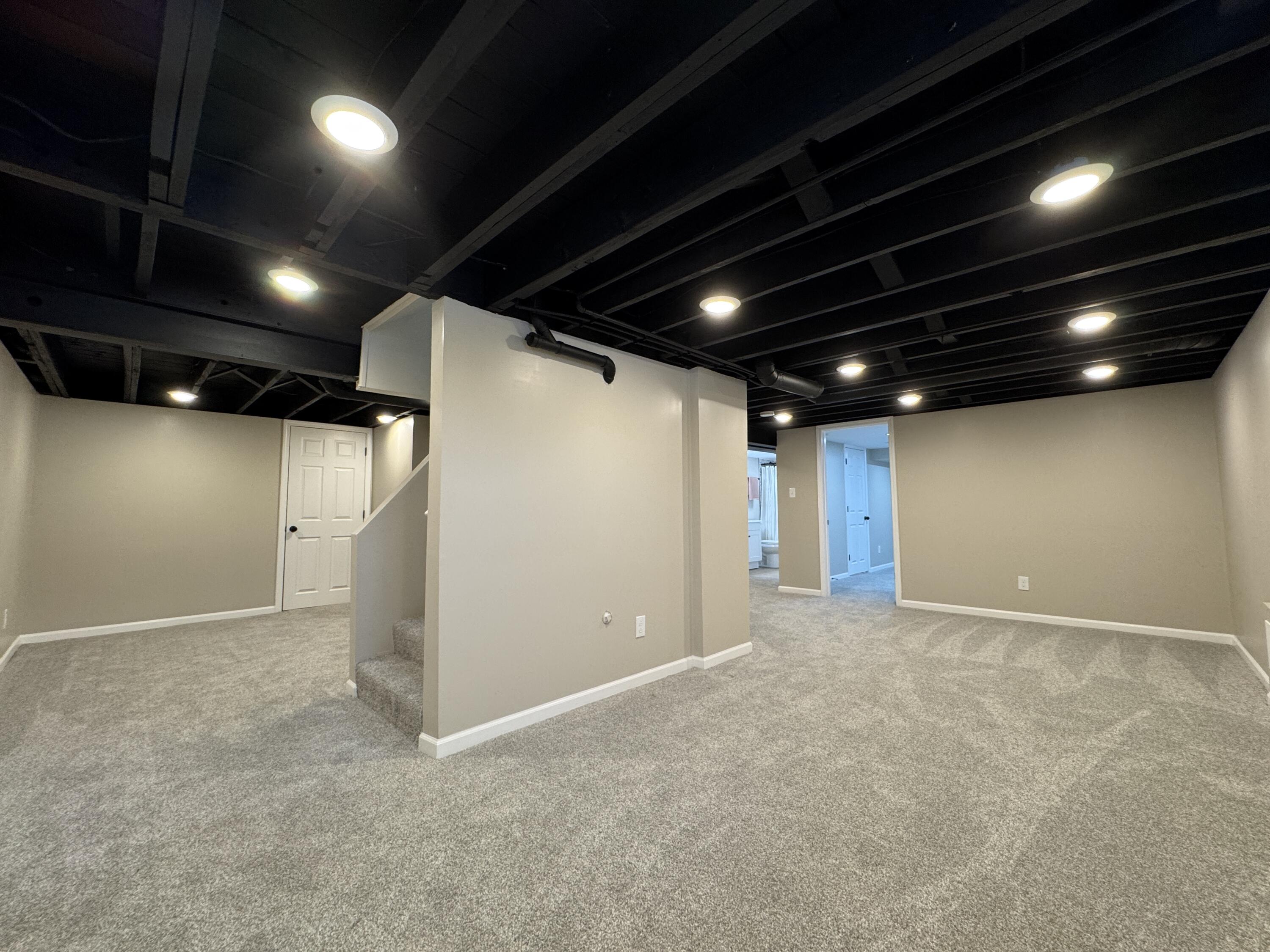 656 Montgomery Street Gary, IN 46403 - Photo 21 of 31 a view of an empty room with a projector