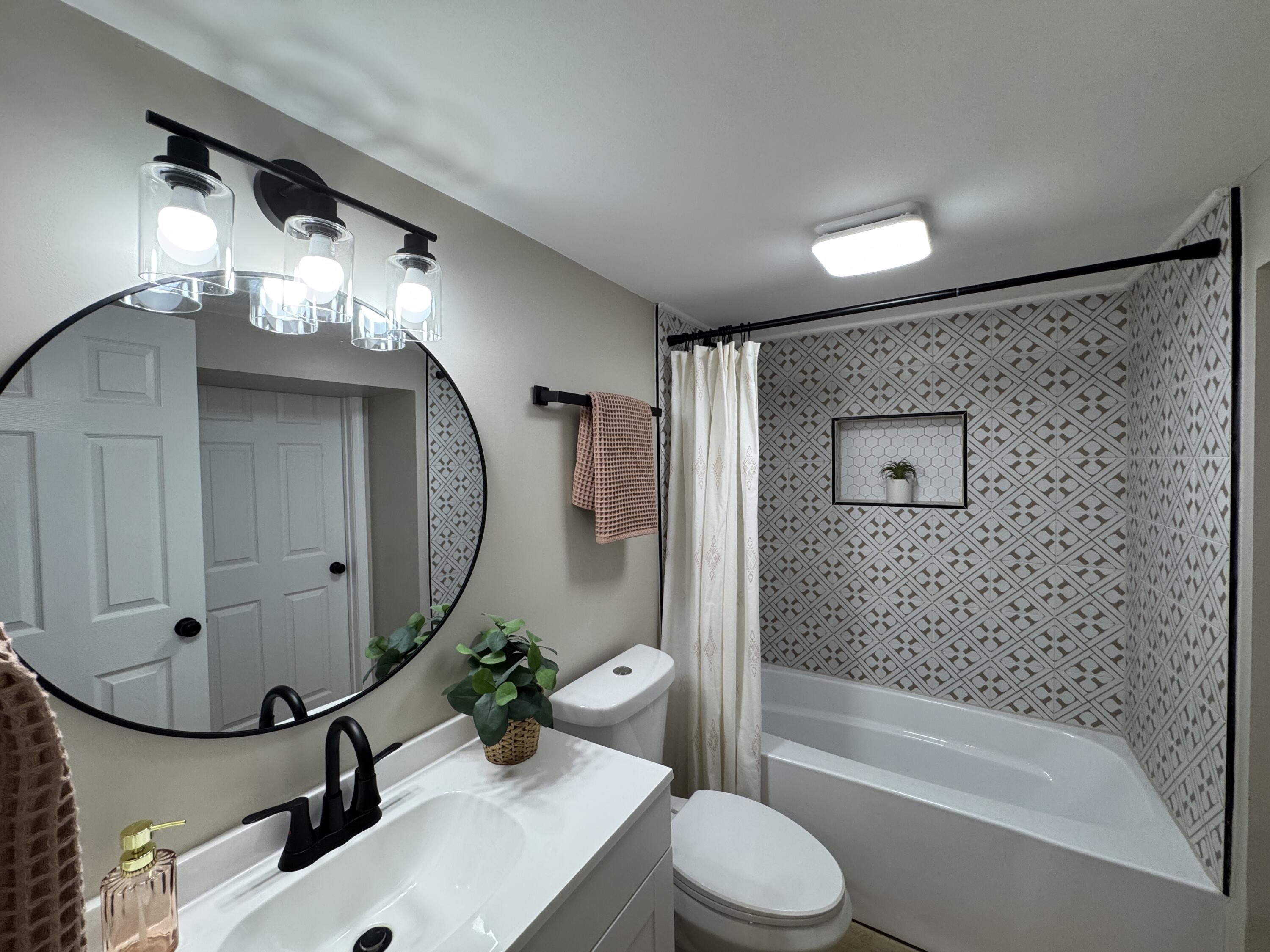 656 Montgomery Street Gary, IN 46403 - Photo 23 of 31 a bathroom with a sink toilet and shower