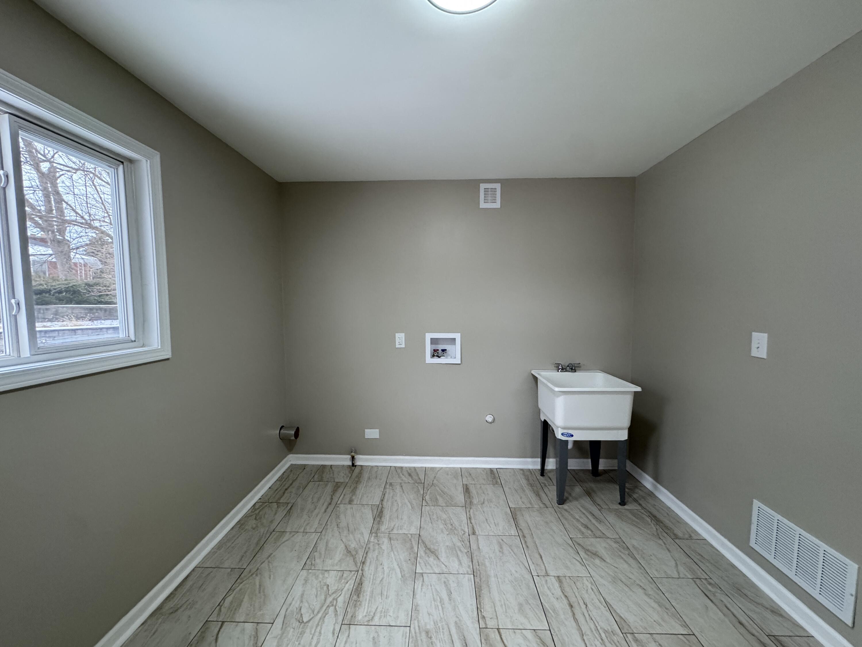 656 Montgomery Street Gary, IN 46403 - Photo 25 of 31 a view of room with a wooden floor and a window