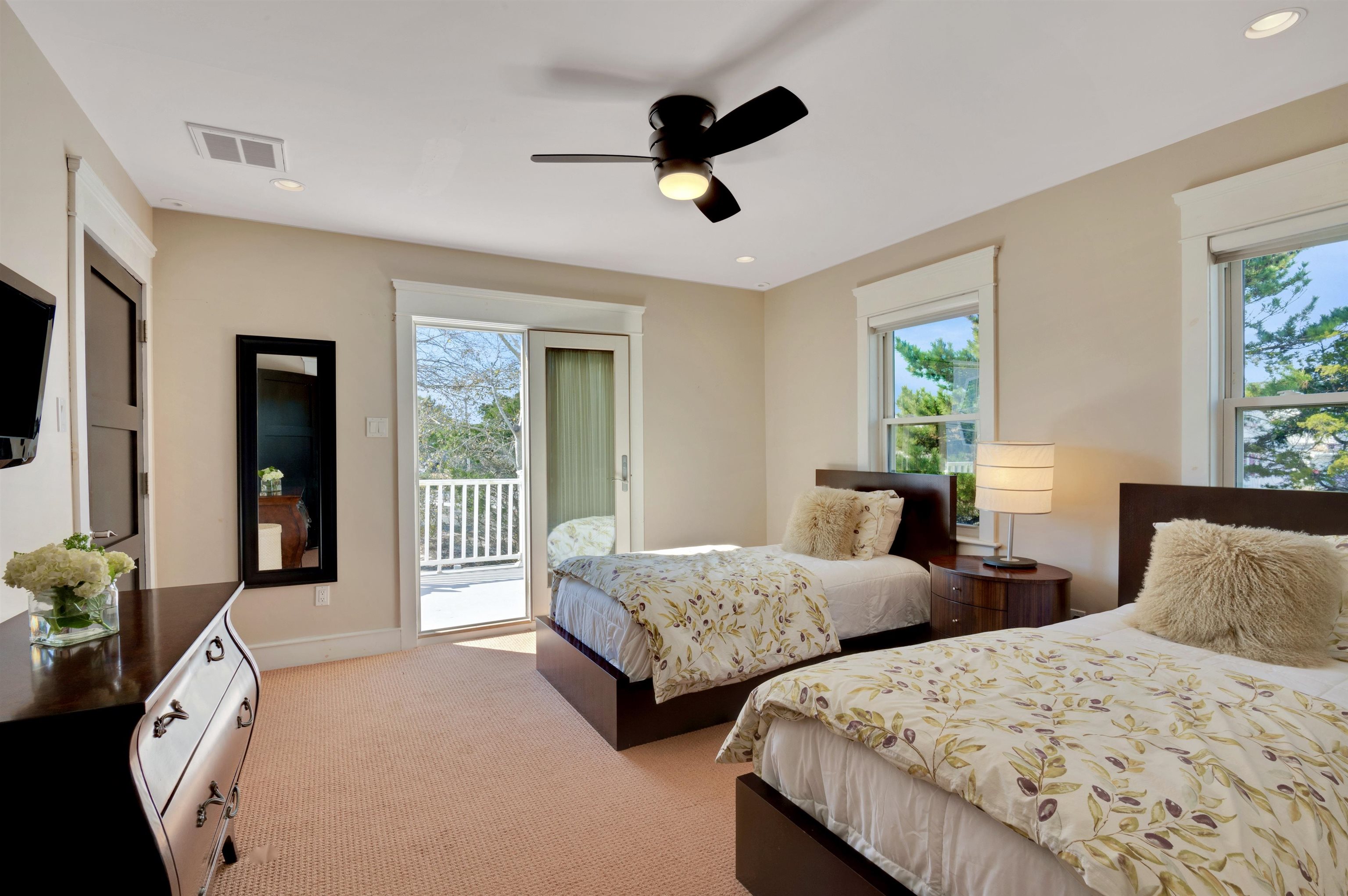 96 Commonwealth Avenue Strathmere, NJ 08248 - Photo 15 of 37 a bedroom with two beds and a large window