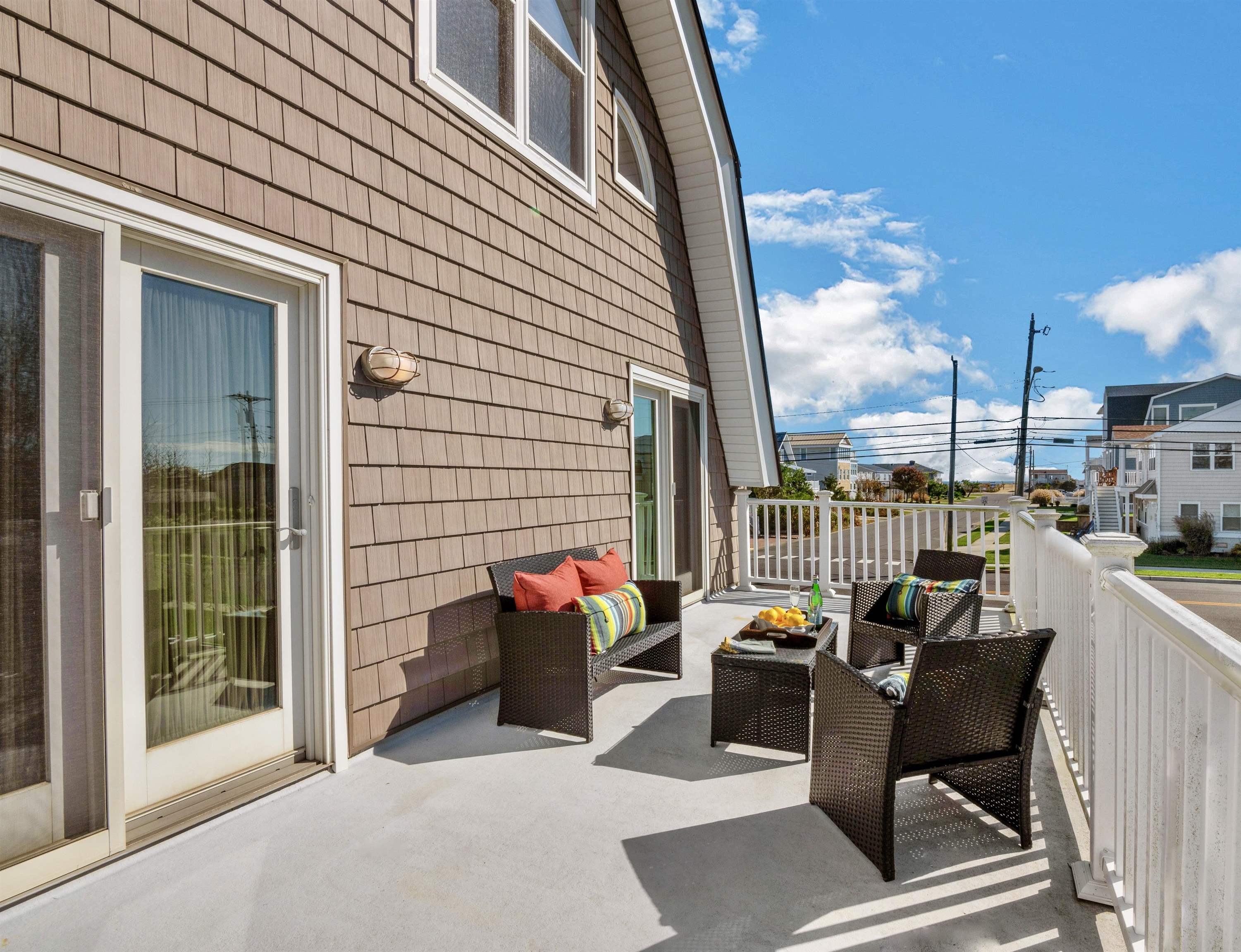 96 Commonwealth Avenue Strathmere, NJ 08248 - Photo 16 of 37 a balcony with furniture and outdoor space