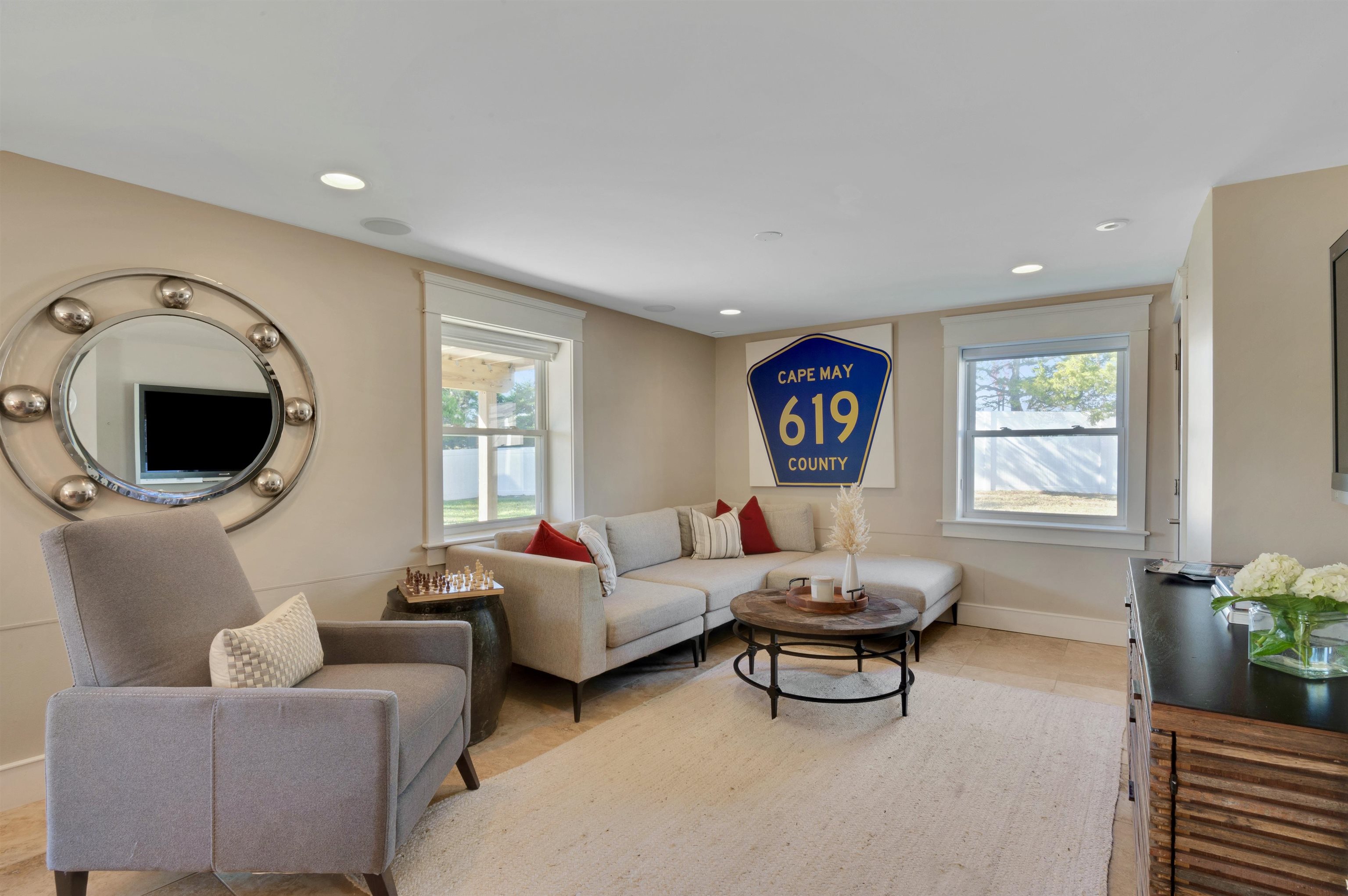 96 Commonwealth Avenue Strathmere, NJ 08248 - Photo 23 of 37 a living room with furniture and a large window