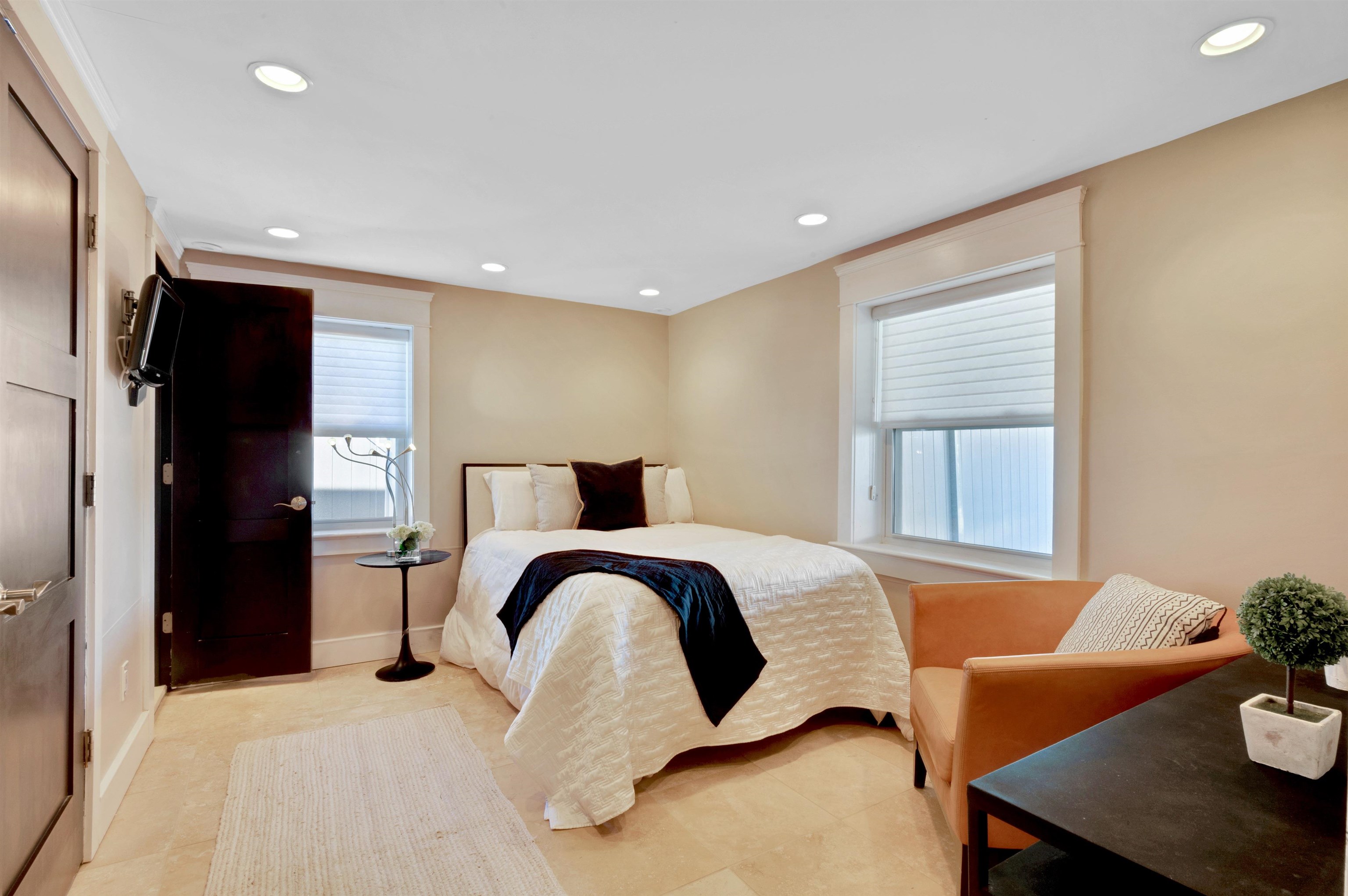 96 Commonwealth Avenue Strathmere, NJ 08248 - Photo 27 of 37 a bedroom with a bed and a table in it