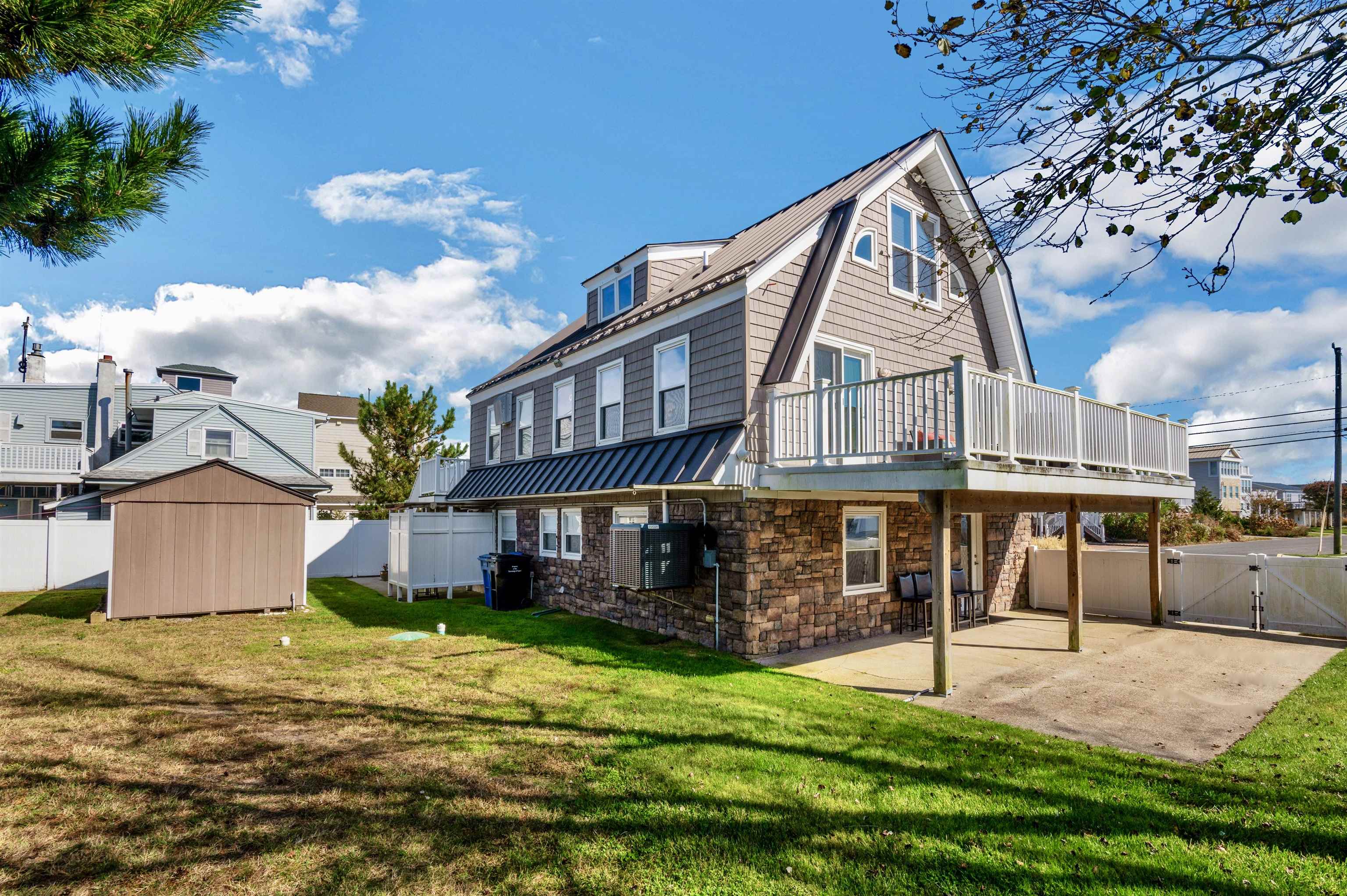 96 Commonwealth Avenue Strathmere, NJ 08248 - Photo 29 of 37 a view of a house with a yard