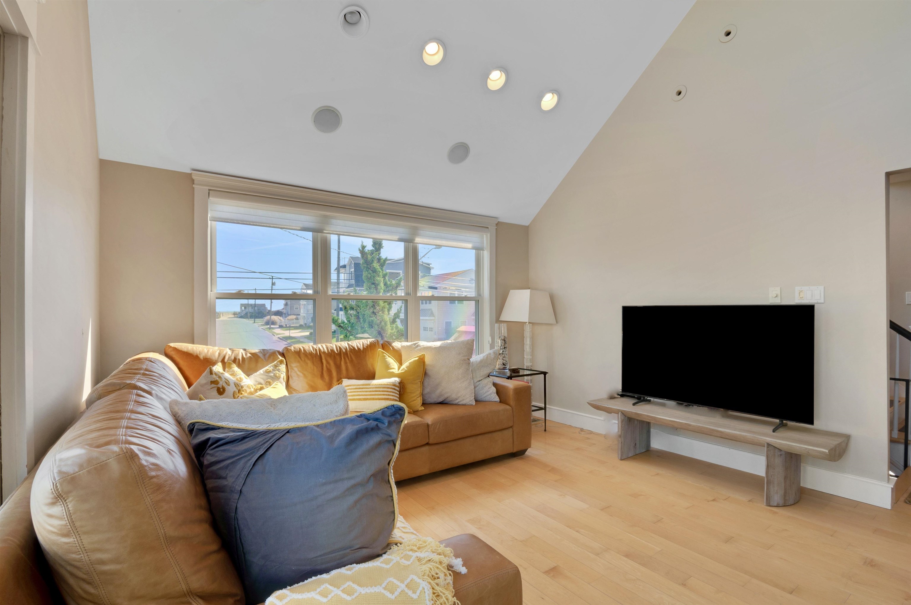 96 Commonwealth Avenue Strathmere, NJ 08248 - Photo 3 of 37 a living room with furniture and a flat screen tv
