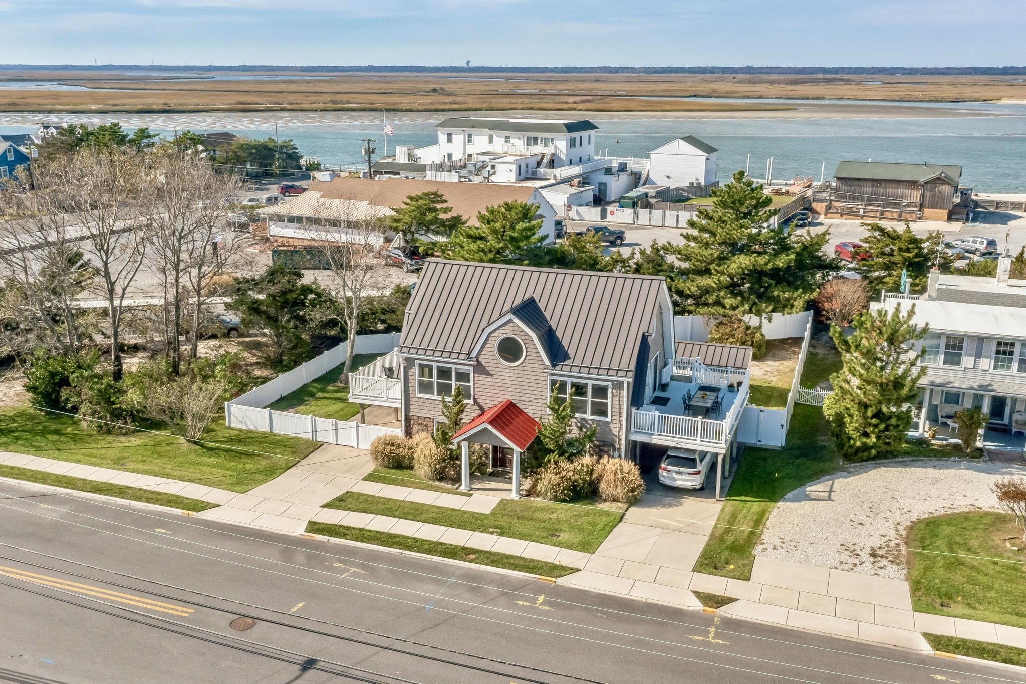 96 Commonwealth Avenue Strathmere, NJ 08248 - Photo 34 of 37 a view of a house with a yard and a fountain