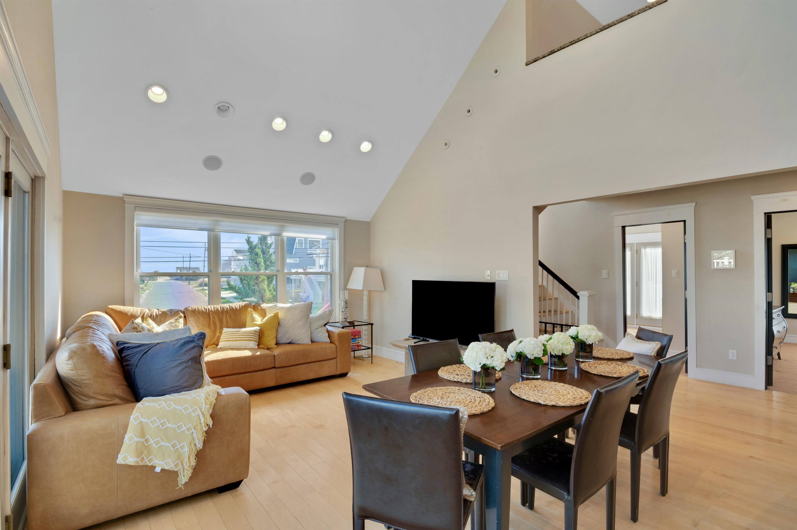 96 Commonwealth Avenue Strathmere, NJ 08248 - Photo 7 of 37 a living room with furniture and a flat screen tv