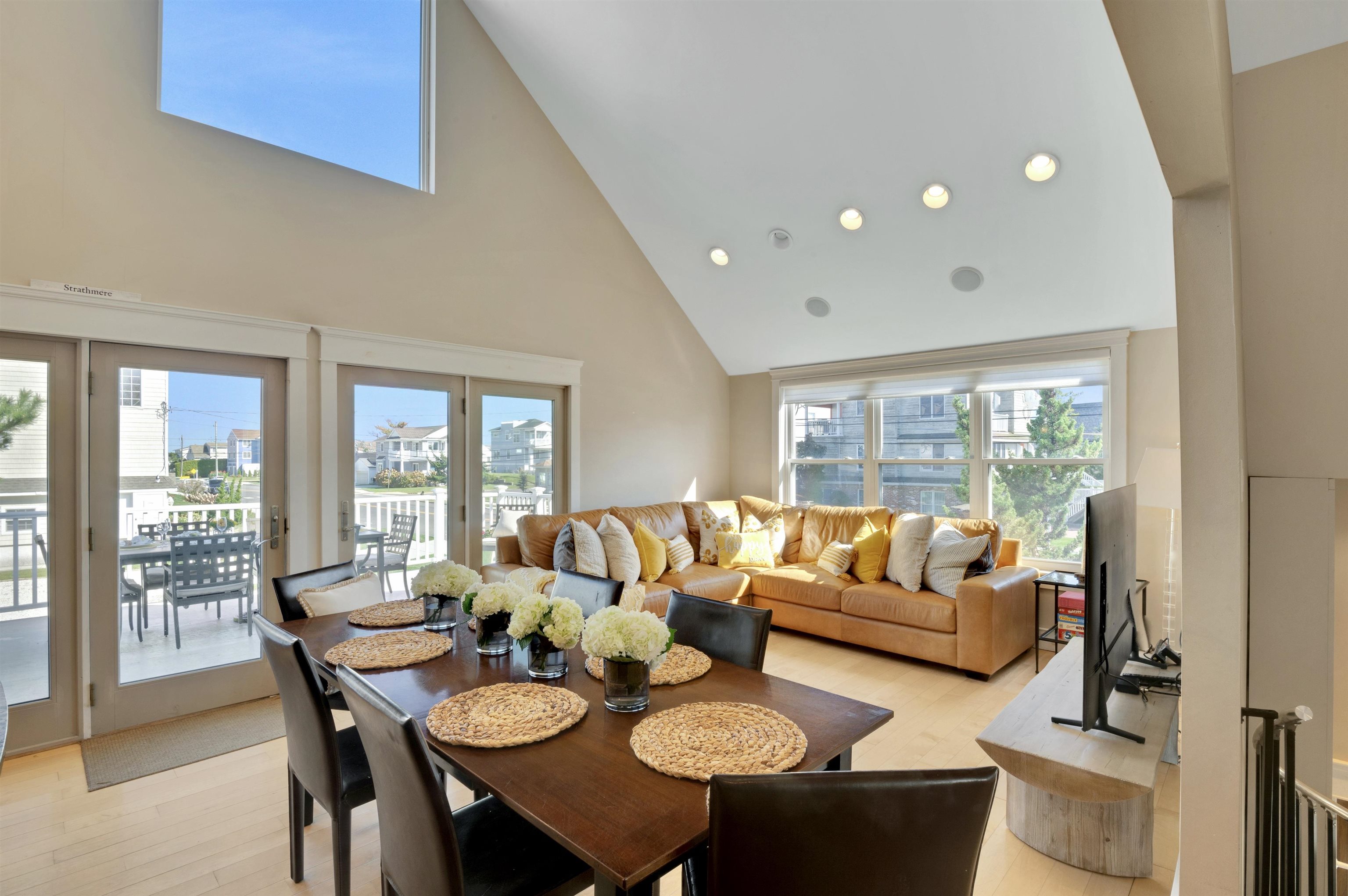 96 Commonwealth Avenue Strathmere, NJ 08248 - Photo 8 of 37 a living room with furniture and a large window