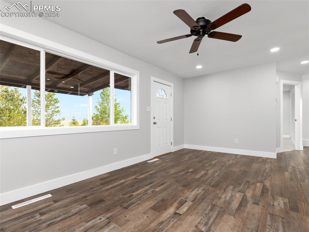 6455 Galbreth Road Pueblo, CO 81005 - Photo 11 of 37 a view of an empty room with a window