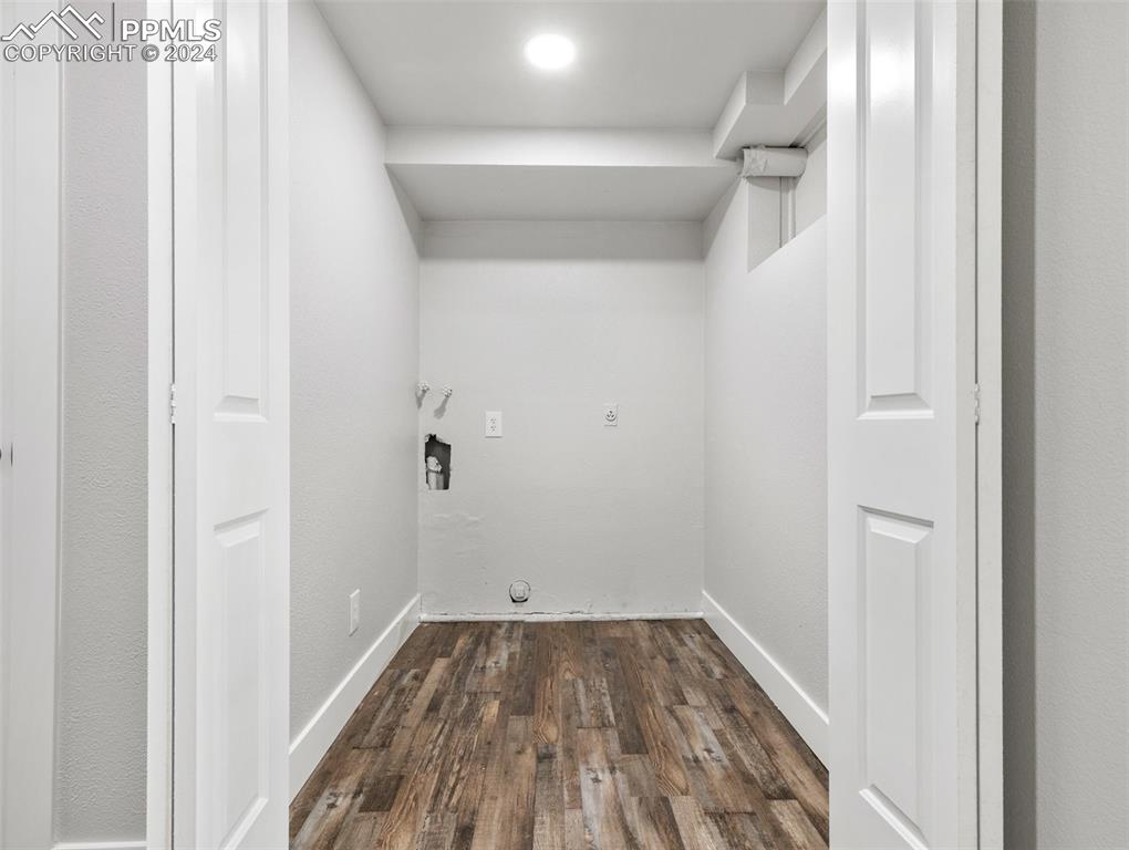 6455 Galbreth Road Pueblo, CO 81005 - Photo 16 of 37 a view of a room with wooden floor