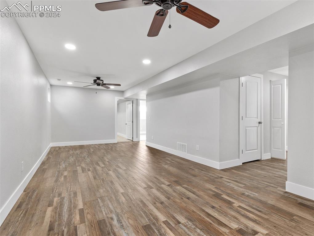 6455 Galbreth Road Pueblo, CO 81005 - Photo 20 of 37 a view of empty room with wooden floor