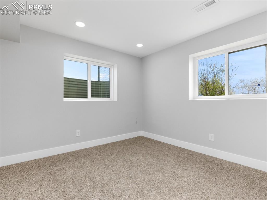 6455 Galbreth Road Pueblo, CO 81005 - Photo 23 of 37 an empty room with windows
