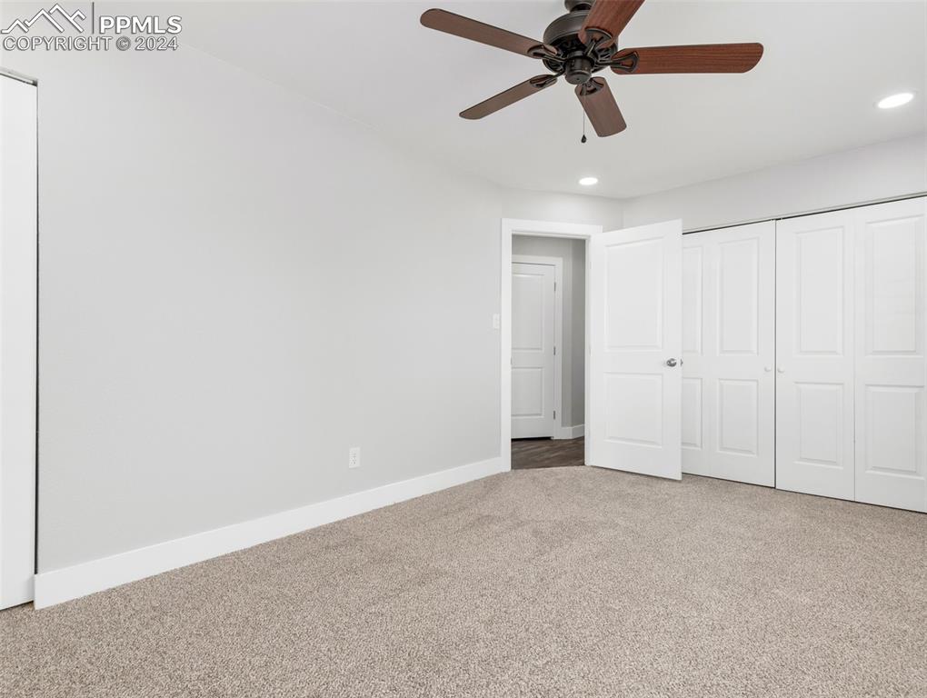 6455 Galbreth Road Pueblo, CO 81005 - Photo 27 of 37 an empty room with chandelier fan