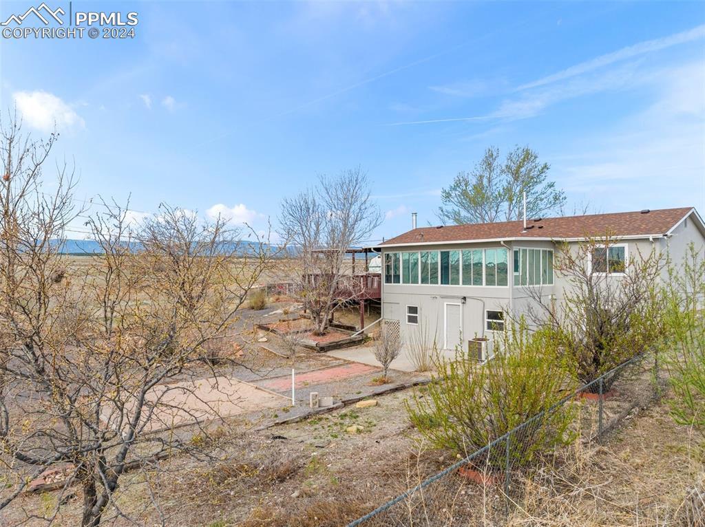 6455 Galbreth Road Pueblo, CO 81005 - Photo 4 of 37 a front view of a house with a yard