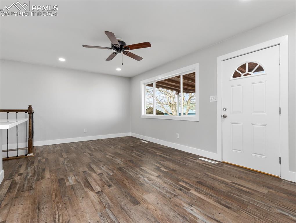 6455 Galbreth Road Pueblo, CO 81005 - Photo 9 of 37 wooden floor in an empty room
