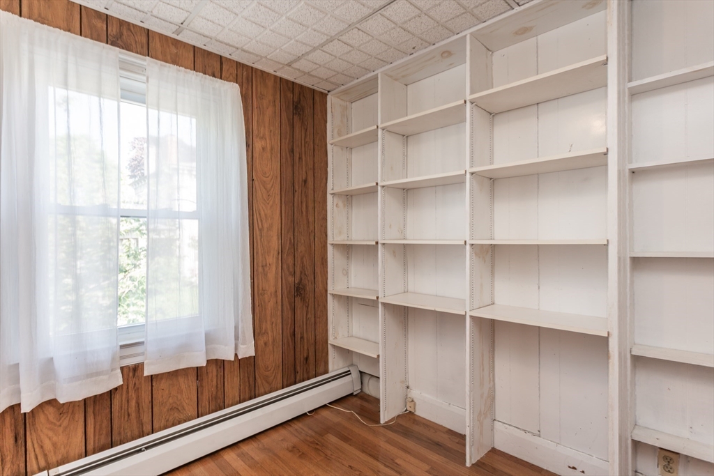 724 High Street Fall River, MA 02720 - Photo 23 of 39 a view of room with window and wooden floor