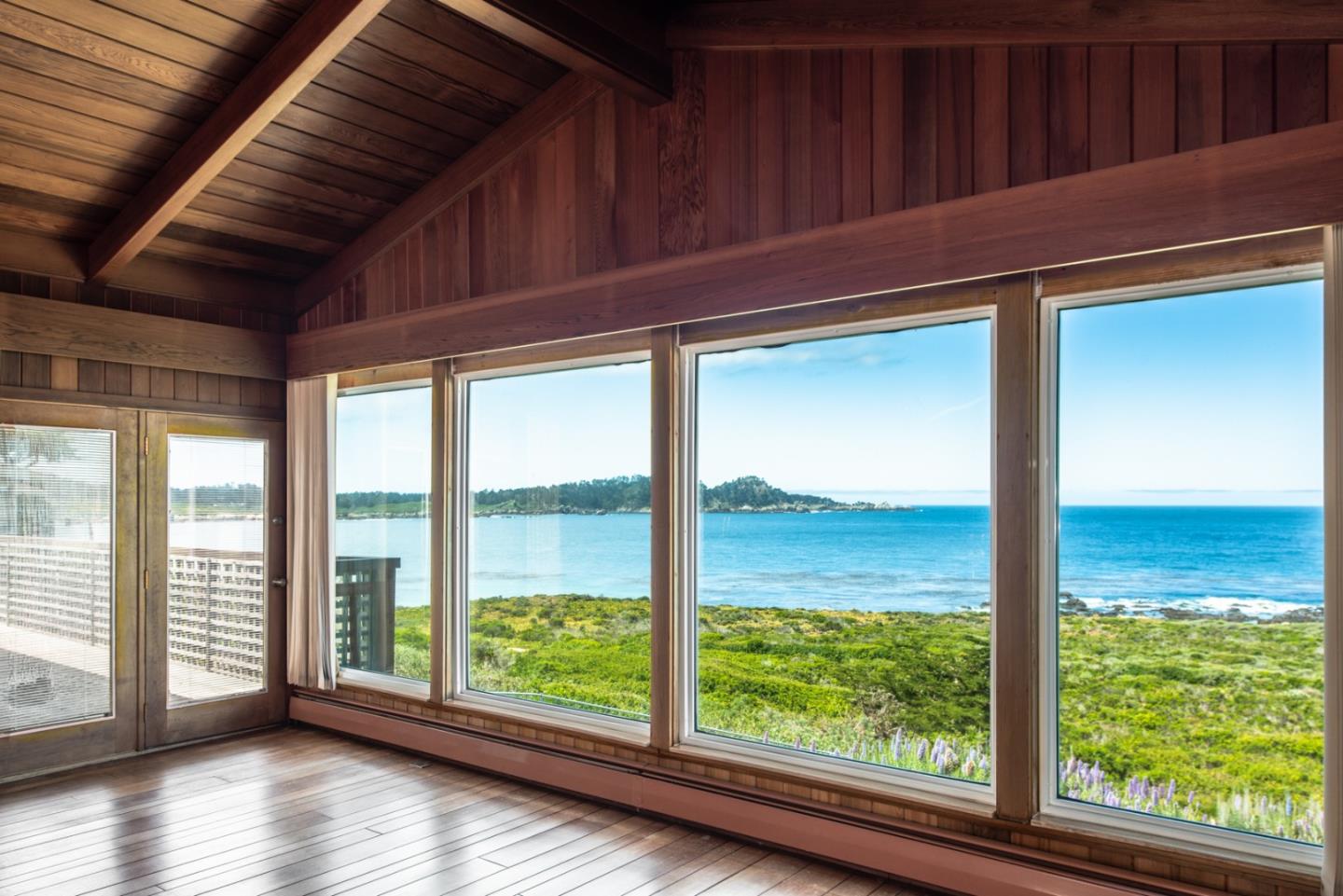 2715 Ribera Road Carmel, CA 93923 - Photo 5 of 14 a view of a room with wooden floor and windows
