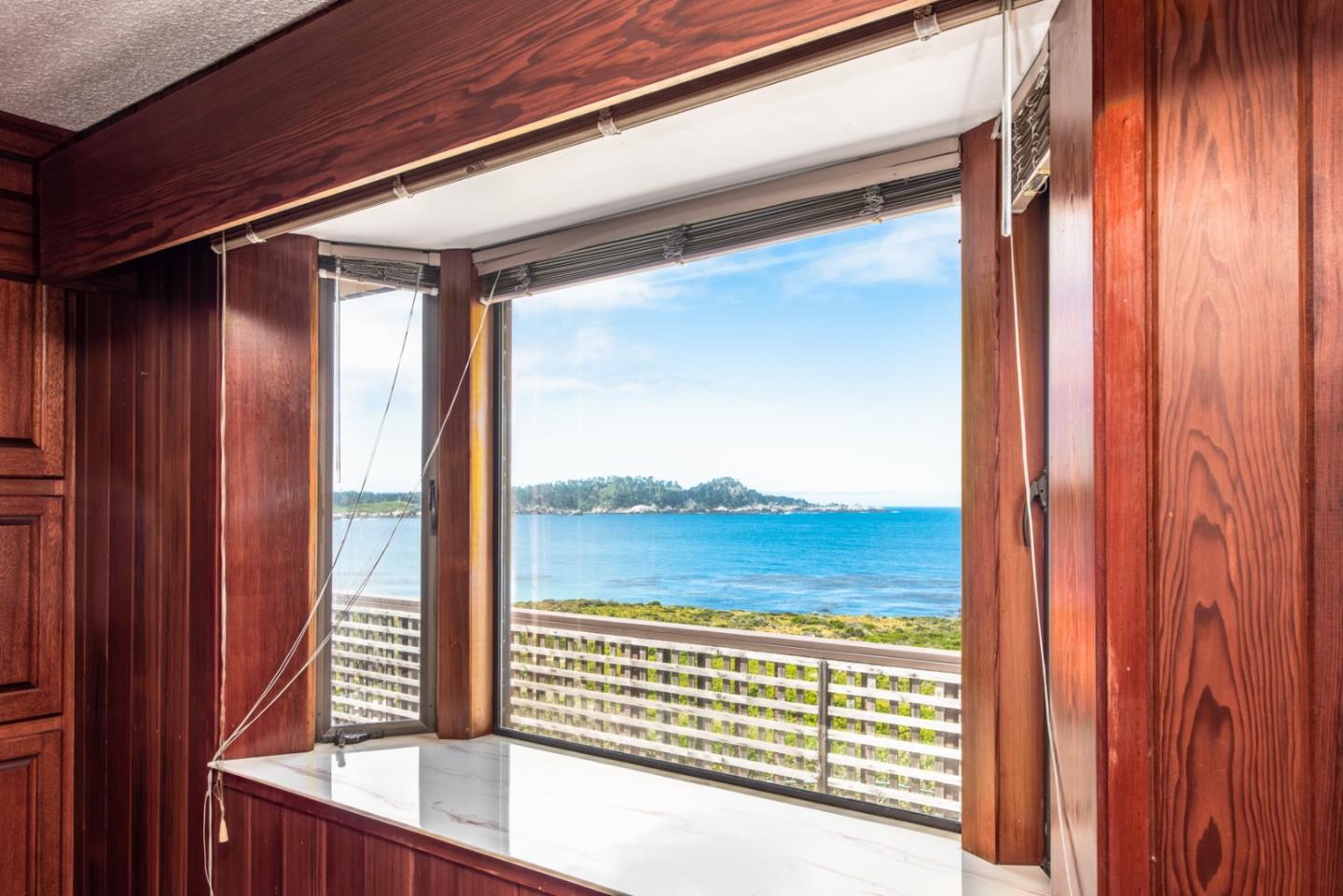 2715 Ribera Road Carmel, CA 93923 - Photo 8 of 14 a view of a room with a large window and wooden floor