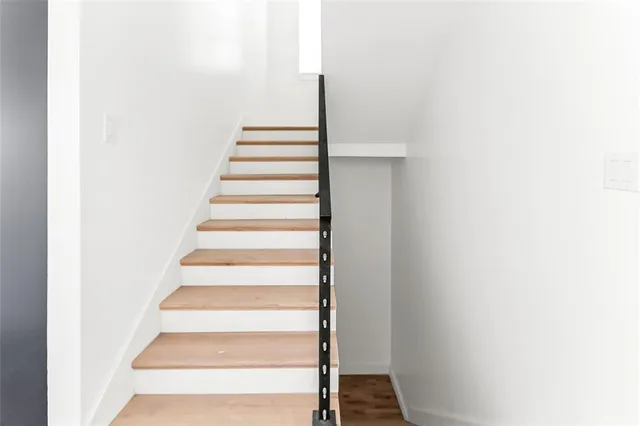 a spacious bathroom with a sink double vanity and a mirror