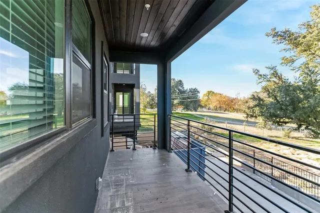 a balcony with an outdoor space
