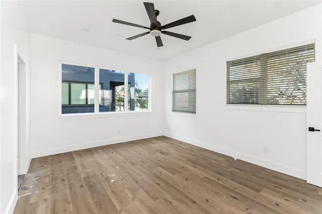 a bathroom with a granite countertop sink a toilet and shower