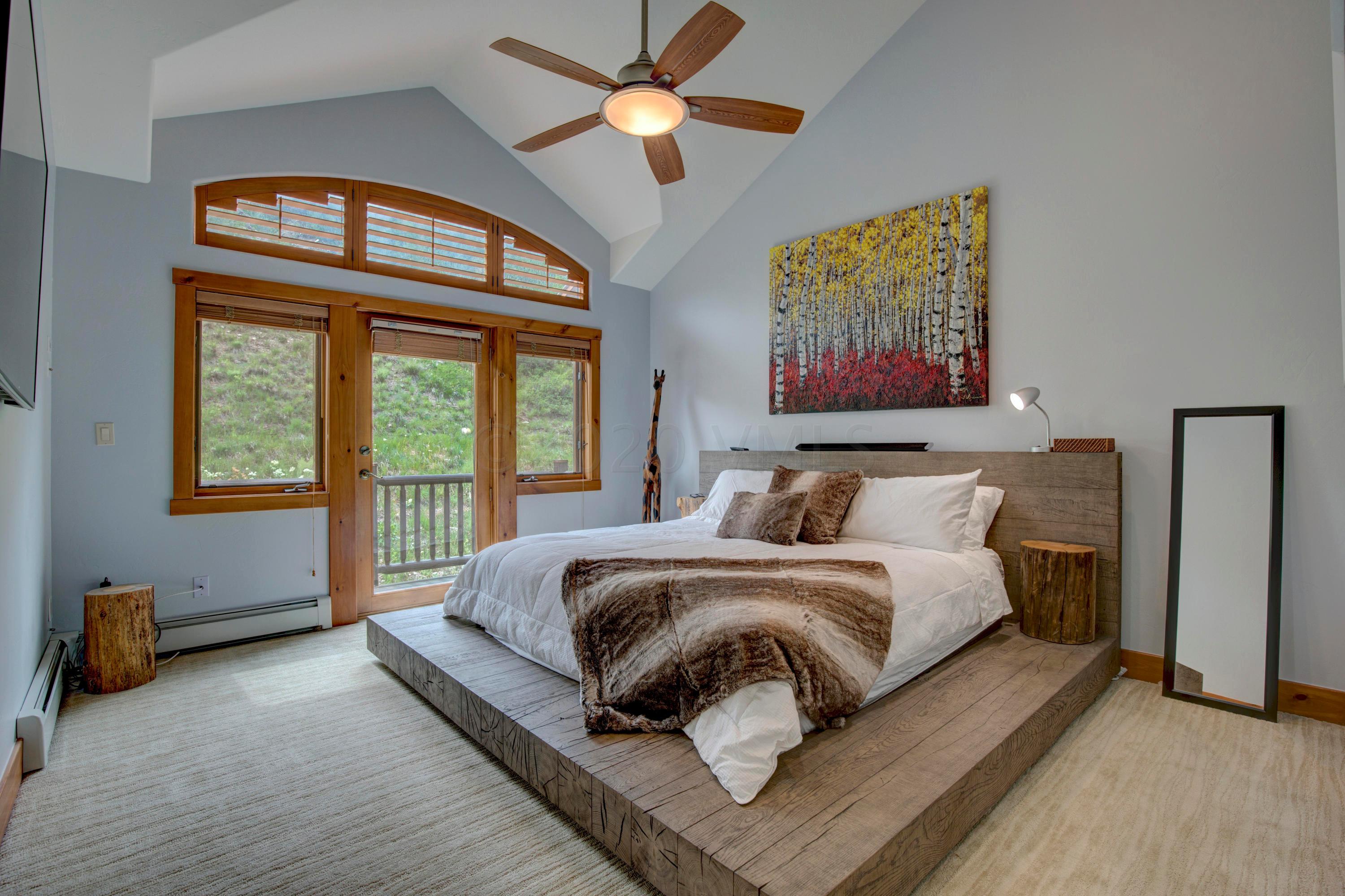 92 Knudson Ranch Road Edwards, CO 81632 - Photo 12 of 26 a bedroom with a bed and a large window