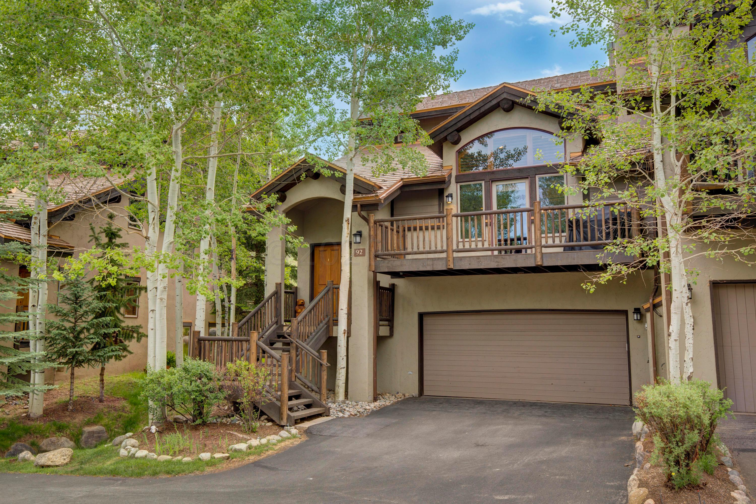 92 Knudson Ranch Road Edwards, CO 81632 - Photo 17 of 26 a front view of a house with a garden