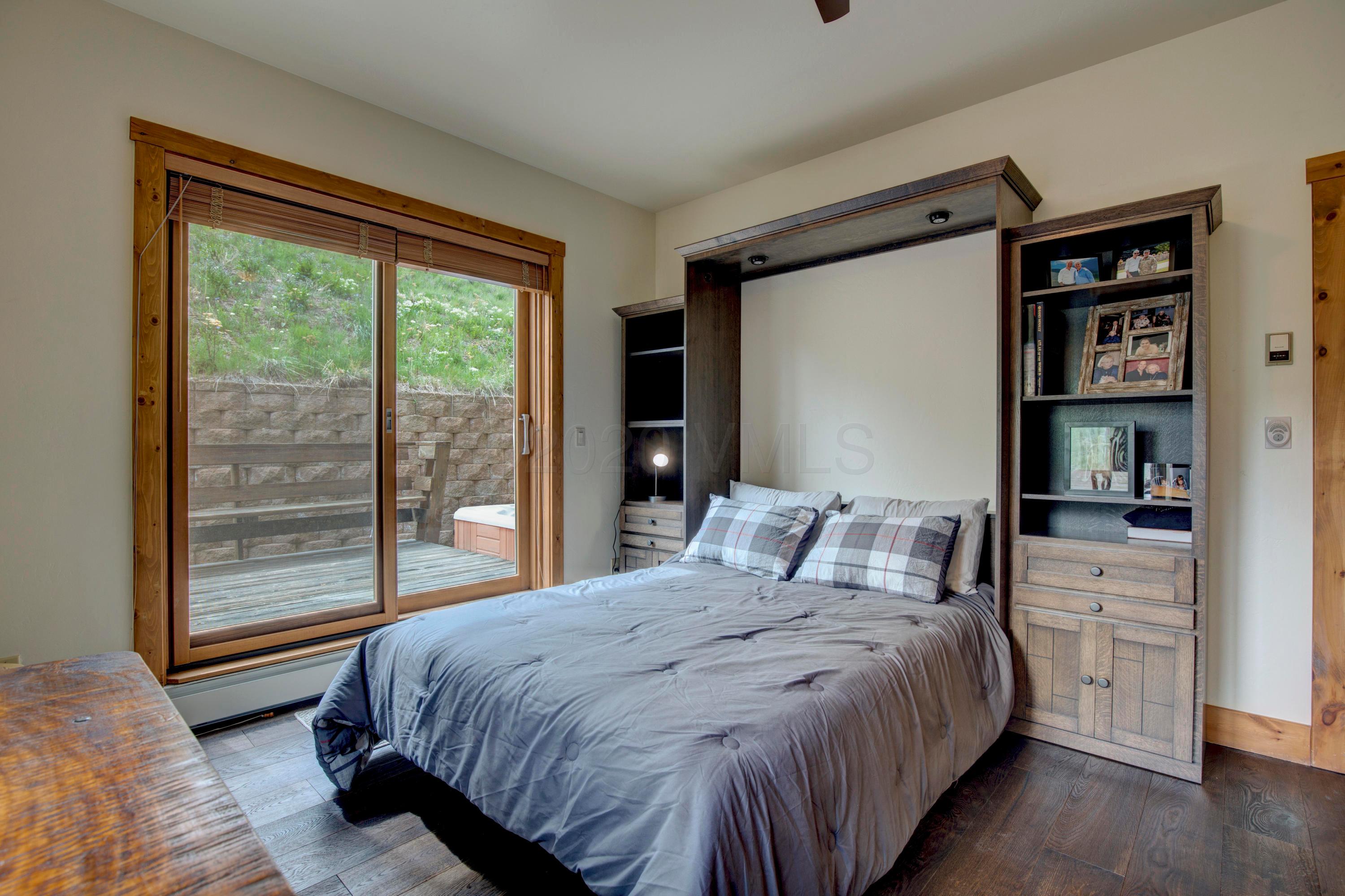92 Knudson Ranch Road Edwards, CO 81632 - Photo 18 of 26 a bedroom with a large bed and a window