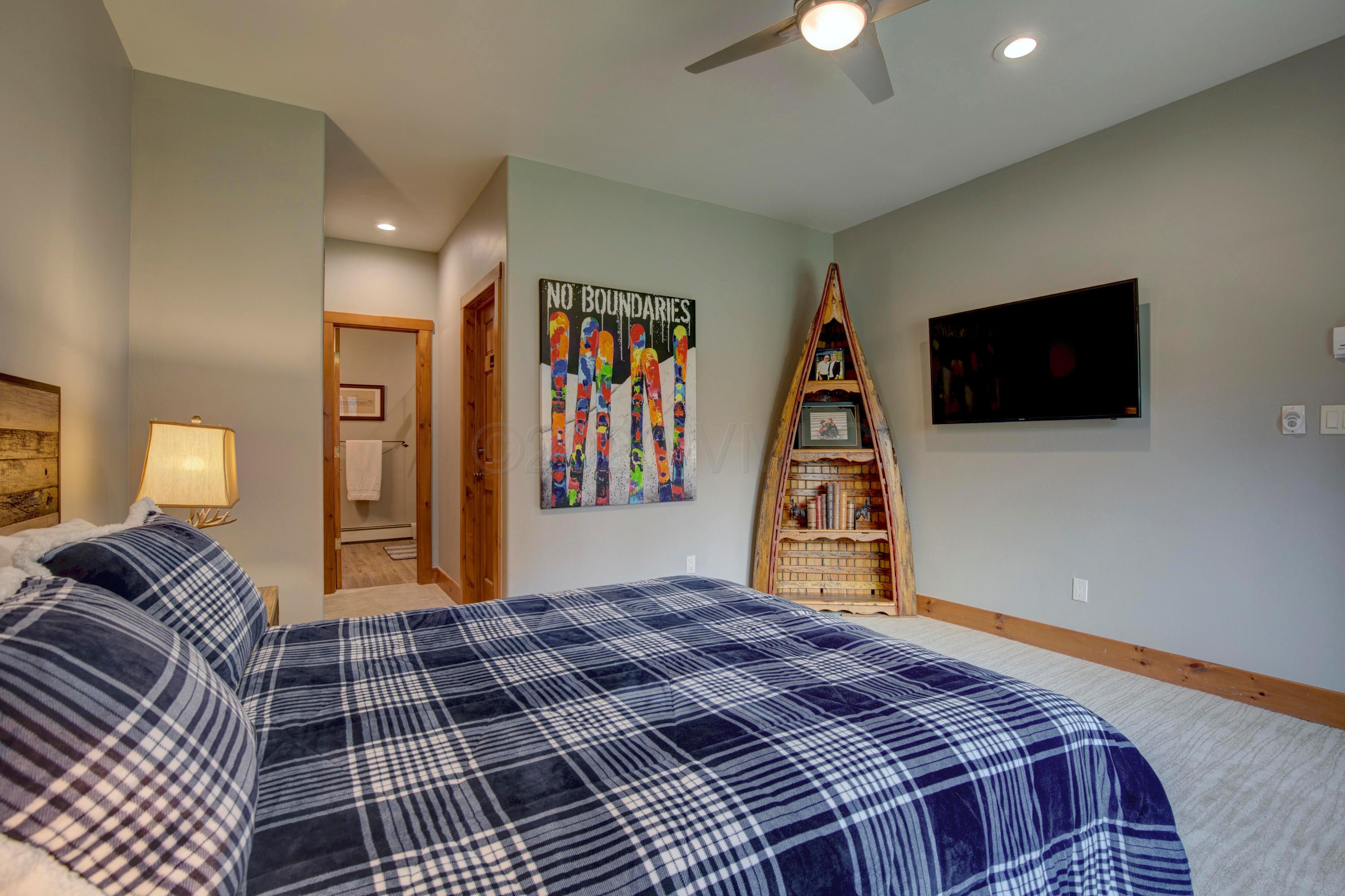 92 Knudson Ranch Road Edwards, CO 81632 - Photo 21 of 26 a bed room with a bed and a television