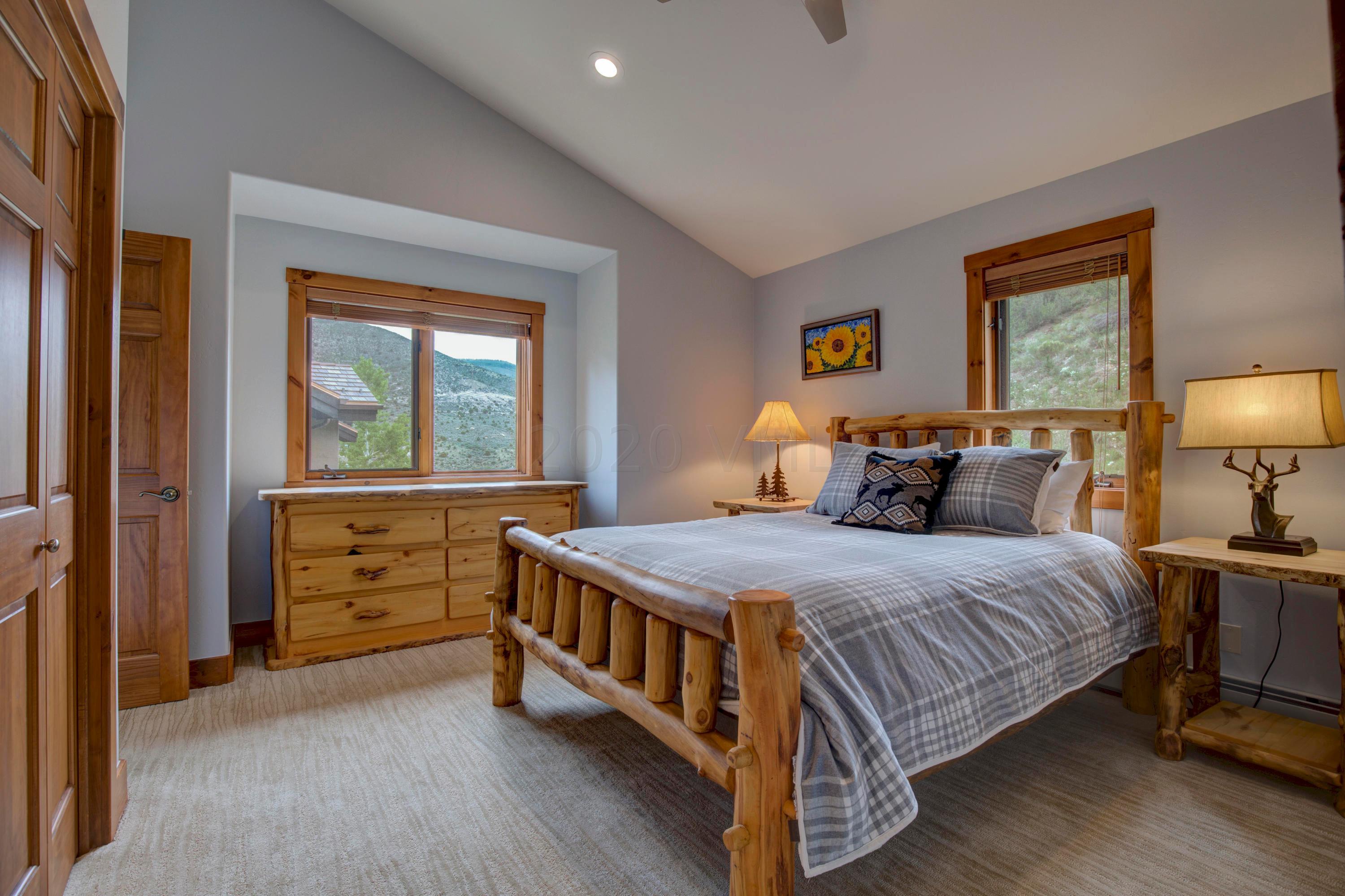 92 Knudson Ranch Road Edwards, CO 81632 - Photo 25 of 26 a bedroom with a bed and a dresser